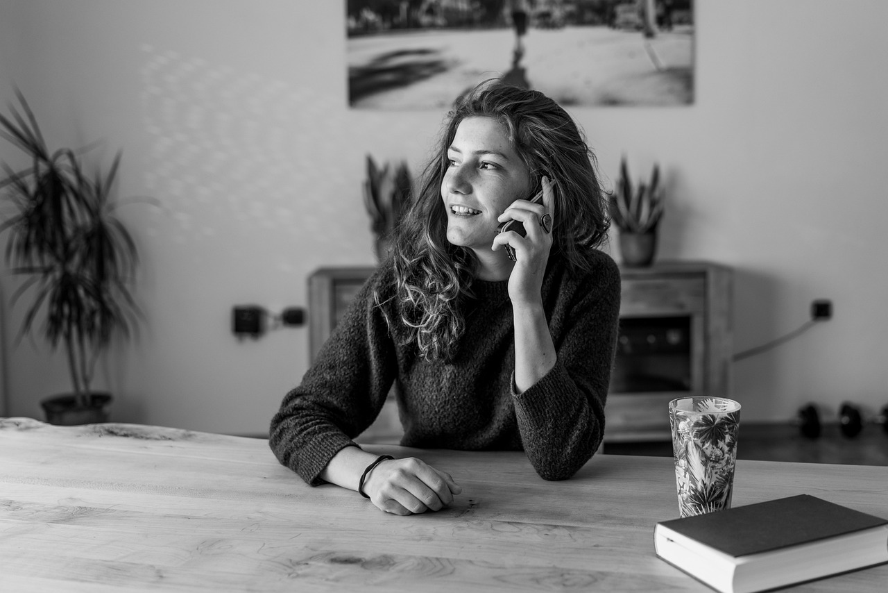 A small business owner taking a customer call, the kind of lead a website should turn a visitor into