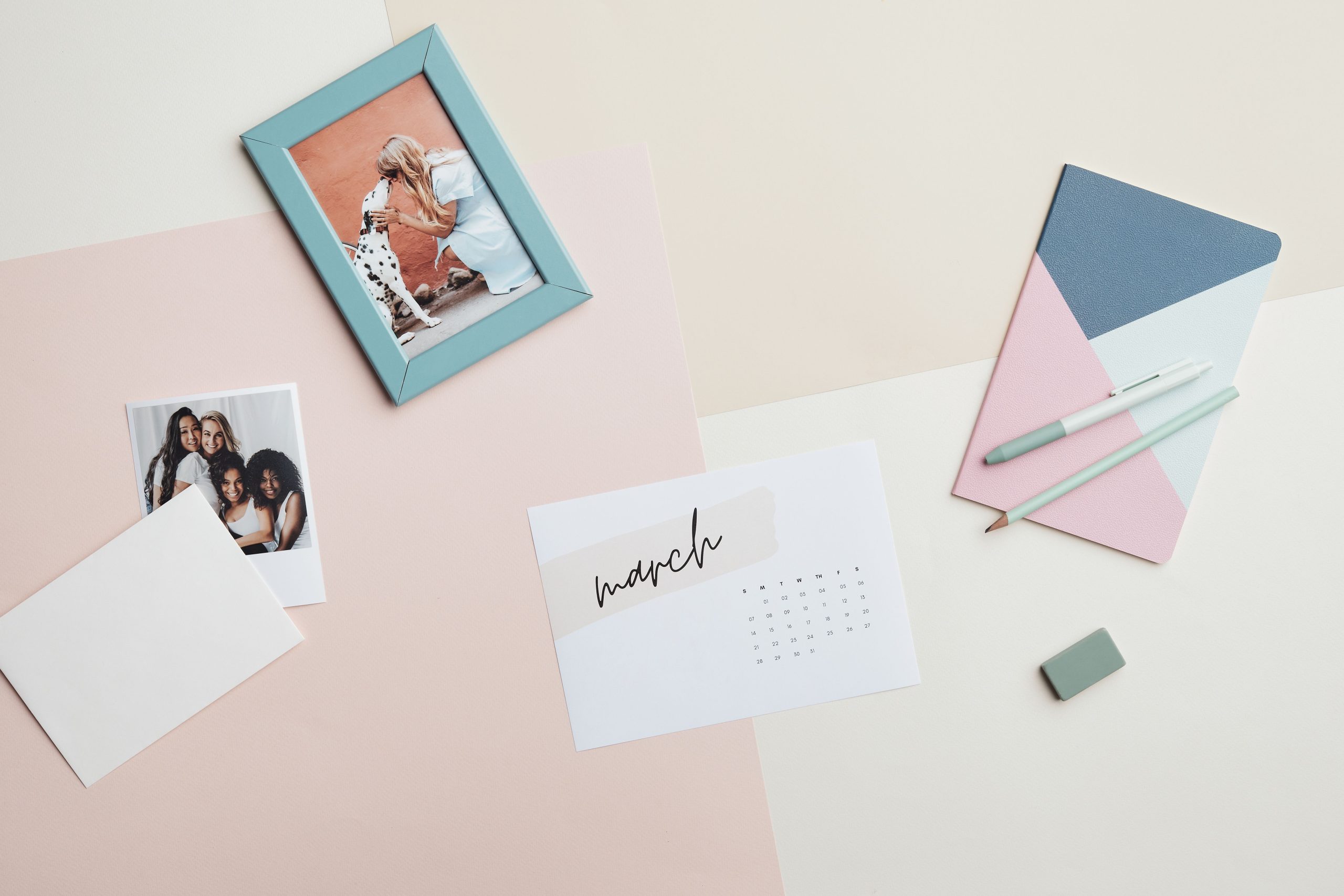 A calendar and stationery laid out on a desk, the kind of simple planning that keeps social media posting off your evenings